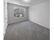 Bright bedroom with grey carpet and large window at 5165 Hanover St, Atlanta, GA 30349