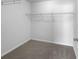 Walk-in closet with wire shelving and grey carpeting at 5165 Hanover St, Atlanta, GA 30349