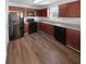 Modern kitchen with dark wood cabinets and black appliances at 5165 Hanover St, Atlanta, GA 30349