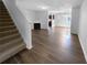 Living area with hardwood floors and a view of the kitchen at 5165 Hanover St, Atlanta, GA 30349