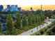 People biking on a paved path toward the Atlanta skyline during sunset at 125 Martin Se Ave, Atlanta, GA 30315