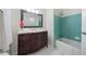 Updated bathroom with dark vanity, tile shower, and bathtub at 2683 Stardust Trl, Decatur, GA 30034