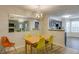 Dining area with light wood table and yellow chairs at 2135 N Forest Trl, Atlanta, GA 30338