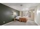 Bedroom with a full bed and dark-green accent wall at 3590 Ashley Woods Dr, Powder Springs, GA 30127