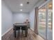 Bright dining area with a large table and access to the backyard at 3590 Ashley Woods Dr, Powder Springs, GA 30127