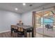 Spacious dining room with sliding door leading to screened porch at 3590 Ashley Woods Dr, Powder Springs, GA 30127