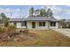 Newly renovated Ranch home with gray roof and well-maintained yard at 3590 Ashley Woods Dr, Powder Springs, GA 30127