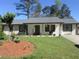 Charming single-story house with a well-maintained lawn at 3590 Ashley Woods Dr, Powder Springs, GA 30127