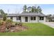 Newly renovated Ranch home with gray roof and landscaped yard at 3590 Ashley Woods Dr, Powder Springs, GA 30127