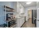 Modern kitchen with white cabinets and granite countertops at 3590 Ashley Woods Dr, Powder Springs, GA 30127