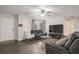 Relaxing living room, featuring hardwood floors and a large TV at 3590 Ashley Woods Dr, Powder Springs, GA 30127