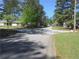 Residential street lined with trees and houses at 3590 Ashley Woods Dr, Powder Springs, GA 30127