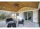 Covered porch with seating area and access to the home at 3590 Ashley Woods Dr, Powder Springs, GA 30127