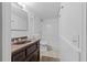 Clean bathroom with brown vanity and tiled shower/tub at 366 E Post Oak Sw Xing, Marietta, GA 30008