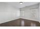 Bright bedroom features wood floors, wainscoting, and windows with shutter-style coverings at 6725 Cross Gate St, Cumming, GA 30040