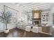 Bright living room with a stone fireplace and built-in shelving at 6725 Cross Gate St, Cumming, GA 30040