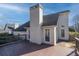 Back of house showcasing deck and chimney at 1280 Sweet Woods Dr, Lawrenceville, GA 30044