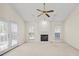 Living room with vaulted ceiling, fireplace and French doors at 1280 Sweet Woods Dr, Lawrenceville, GA 30044