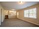 Finished basement with neutral carpet and large window at 2668 Woodfen Dr, Ellenwood, GA 30294