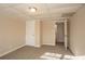 Well-lit basement bedroom with access to another room and hallway at 2668 Woodfen Dr, Ellenwood, GA 30294