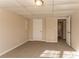 Spacious finished basement bedroom with neutral carpeting and ample closet space at 2668 Woodfen Dr, Ellenwood, GA 30294
