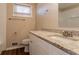 Bathroom with granite countertop, white cabinets, and updated fixtures at 2668 Woodfen Dr, Ellenwood, GA 30294