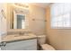 Clean bathroom with granite countertop, white vanity, and updated fixtures at 2668 Woodfen Dr, Ellenwood, GA 30294