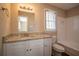 Updated bathroom with granite countertop and white vanity at 2668 Woodfen Dr, Ellenwood, GA 30294