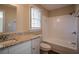 Clean bathroom with granite countertop and bathtub at 2668 Woodfen Dr, Ellenwood, GA 30294