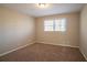 Bright bedroom with neutral walls and carpet flooring at 2668 Woodfen Dr, Ellenwood, GA 30294