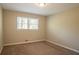 Spacious bedroom with neutral walls and carpet flooring at 2668 Woodfen Dr, Ellenwood, GA 30294