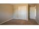 Simple bedroom with neutral walls and carpet flooring at 2668 Woodfen Dr, Ellenwood, GA 30294
