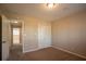 Cozy bedroom with neutral walls and carpet flooring at 2668 Woodfen Dr, Ellenwood, GA 30294