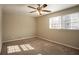 Spacious bedroom with ceiling fan and neutral carpeting at 2668 Woodfen Dr, Ellenwood, GA 30294