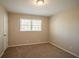 Spacious bedroom with neutral walls and carpet flooring at 2668 Woodfen Dr, Ellenwood, GA 30294