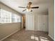 Large bedroom with double closets and ceiling fan at 2668 Woodfen Dr, Ellenwood, GA 30294