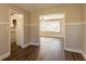 Dining area with hardwood floors and kitchen access at 2668 Woodfen Dr, Ellenwood, GA 30294