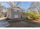 Gray brick house with a backyard and patio at 2668 Woodfen Dr, Ellenwood, GA 30294
