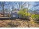 Gray brick house situated on a large lot with mature trees at 2668 Woodfen Dr, Ellenwood, GA 30294