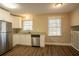 Updated kitchen featuring stainless steel appliances and granite countertops at 2668 Woodfen Dr, Ellenwood, GA 30294