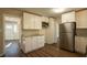 Modern kitchen with stainless steel appliances and granite countertops at 2668 Woodfen Dr, Ellenwood, GA 30294