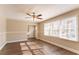 Spacious living room with hardwood floors and large windows at 2668 Woodfen Dr, Ellenwood, GA 30294