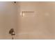 Clean shower with tiled walls and built-in shelf at 2668 Woodfen Dr, Ellenwood, GA 30294