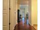 Bright hallway with hardwood floors, leading to other rooms at 3380 Rock Creek Dr, Rex, GA 30273