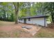 Backyard patio, grassy area, and mature trees at 1847 Elmwood Dr, Austell, GA 30106