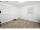 Simple bedroom with two windows and laminate flooring at 1847 Elmwood Dr, Austell, GA 30106