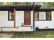 House exterior featuring a white brick facade and wood accents at 1847 Elmwood Dr, Austell, GA 30106