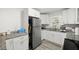 Bright kitchen with granite countertops and white cabinets at 1847 Elmwood Dr, Austell, GA 30106