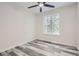 Bright bedroom with ceiling fan and hardwood floors at 253 Fletcher Sw St, Atlanta, GA 30315