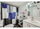 Clean bathroom with a shower/tub combo and updated vanity at 4809 Hemlock Sw Dr, Austell, GA 30106
